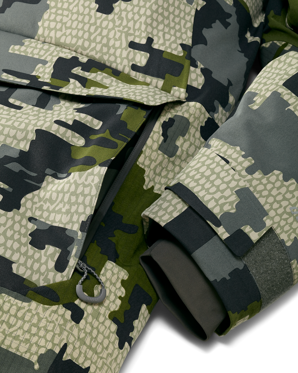 Front of Super Down Arktuk Parka in Verde Camouflage, Highlighting zippered hand pocket and adjustable adjustable hook-and-loop cuffs with internal stretch gasket cuffs 