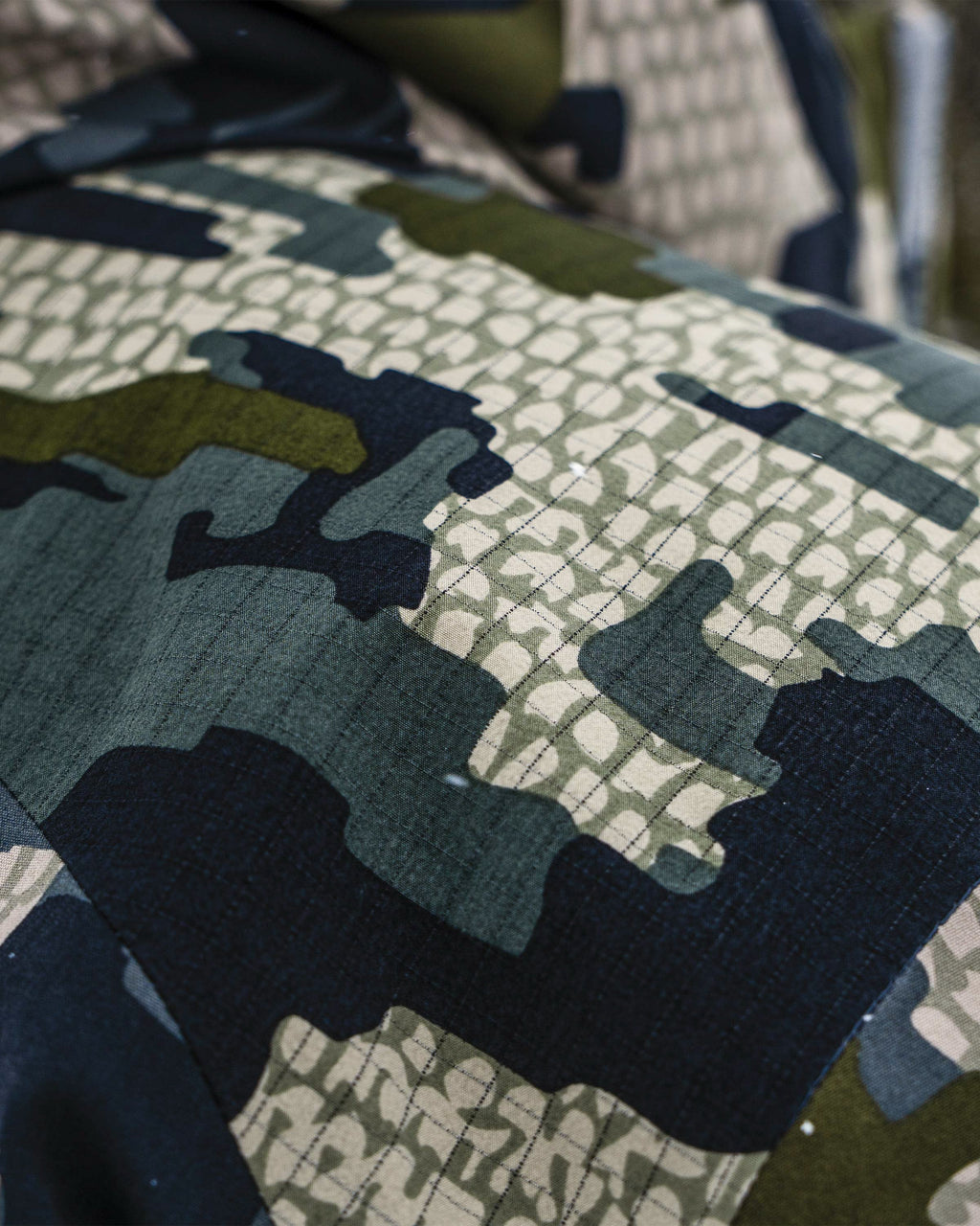 Close-up of Super Down Arktuk Parka in Verde Camouflage external waterproof material